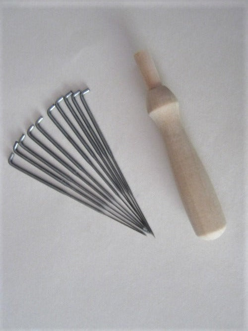 Wooden Needle holder and 10 needles.