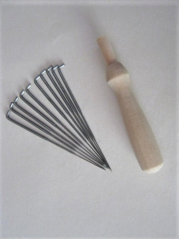 Wooden Needle holder and 10 needles. 
